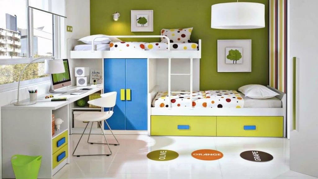 A colorful staggered bunk bed and a study table in kids room