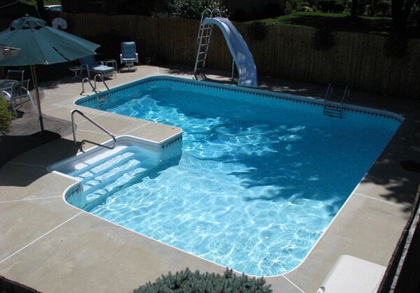 A L shaped pool with curved edges to create an unique shape