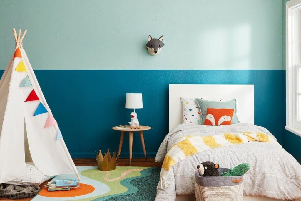 Kids room designed in calm colors like blue cyan and white with a tent placed inside