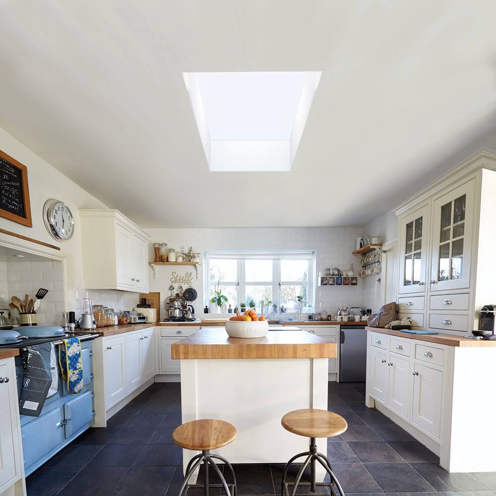 Flat skylight installed on the top of the island kitchen