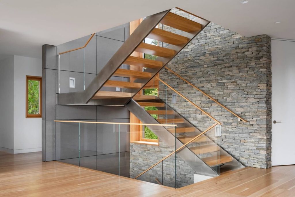Luxurious Staircase made in wooden with glass railing