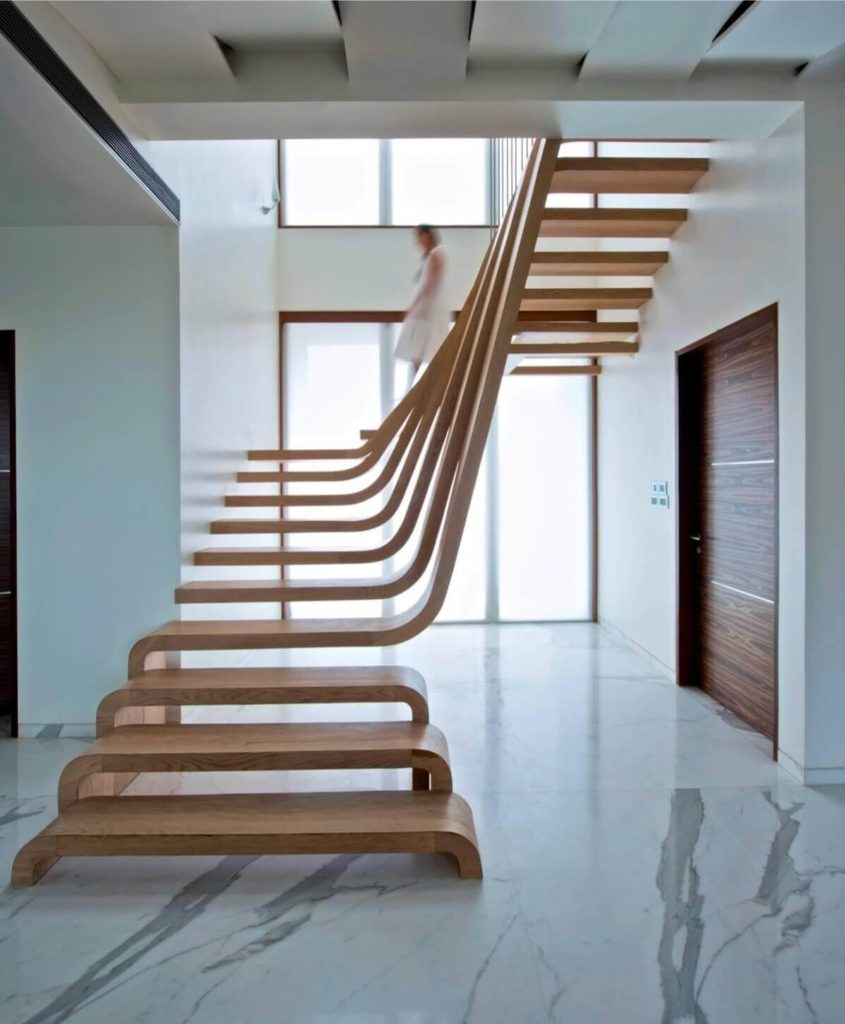 Floating staircase made in wood and attached to both the walls