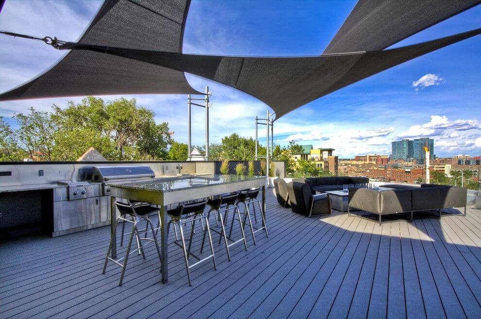 Sail shade on terrace with dining space and seating