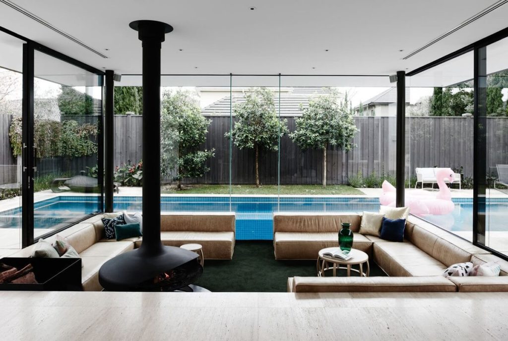 Sunken Living Room with a backyard pool view