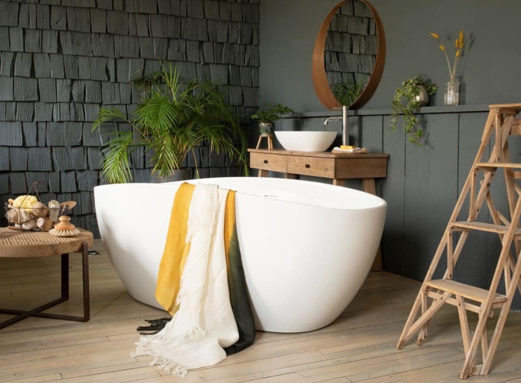 Bathroom image with black wall and white tub