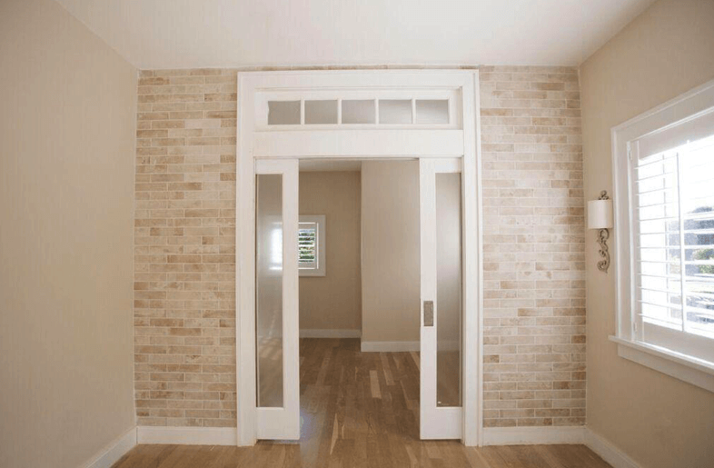 louvred white door with glass
